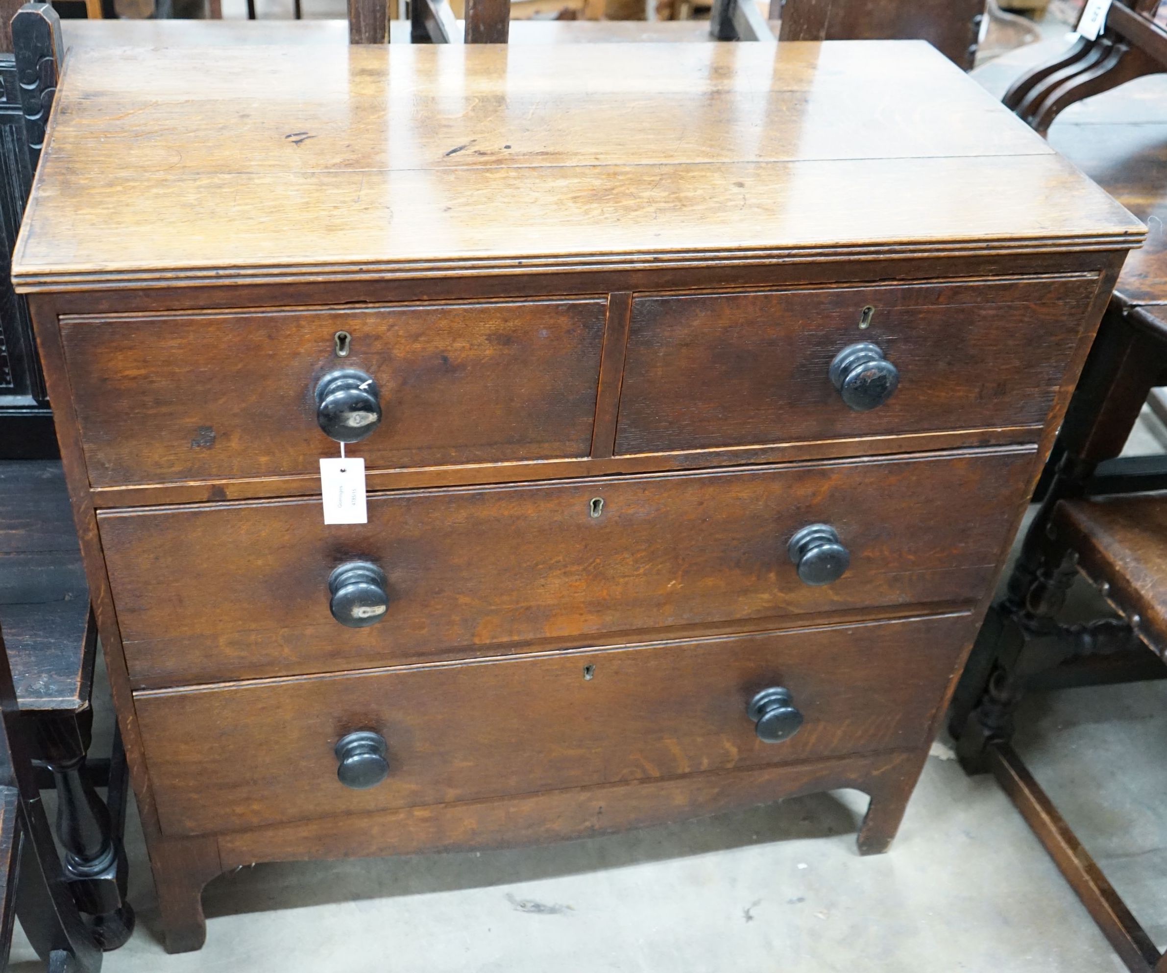 A small Regency provincial oak chest of two short and two long drawers, width 90cm, depth 44cm, height 89cm